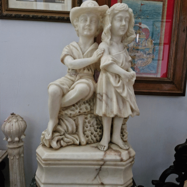 Boy and Girl leaning on rock